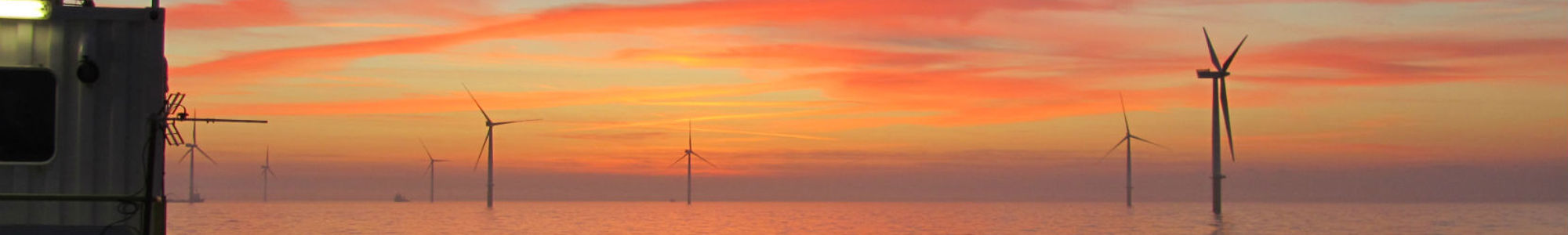 Offshore Wind Windmills At Sunset